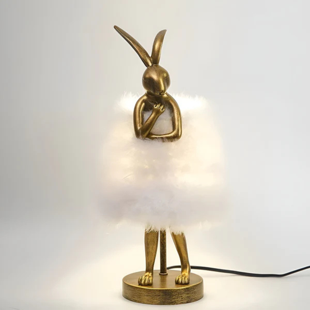 "Rabby - Lampada Notturna a Forma di Coniglio" can be rewritten as "Rabby - Lampada Notturna a Design di Coniglio".