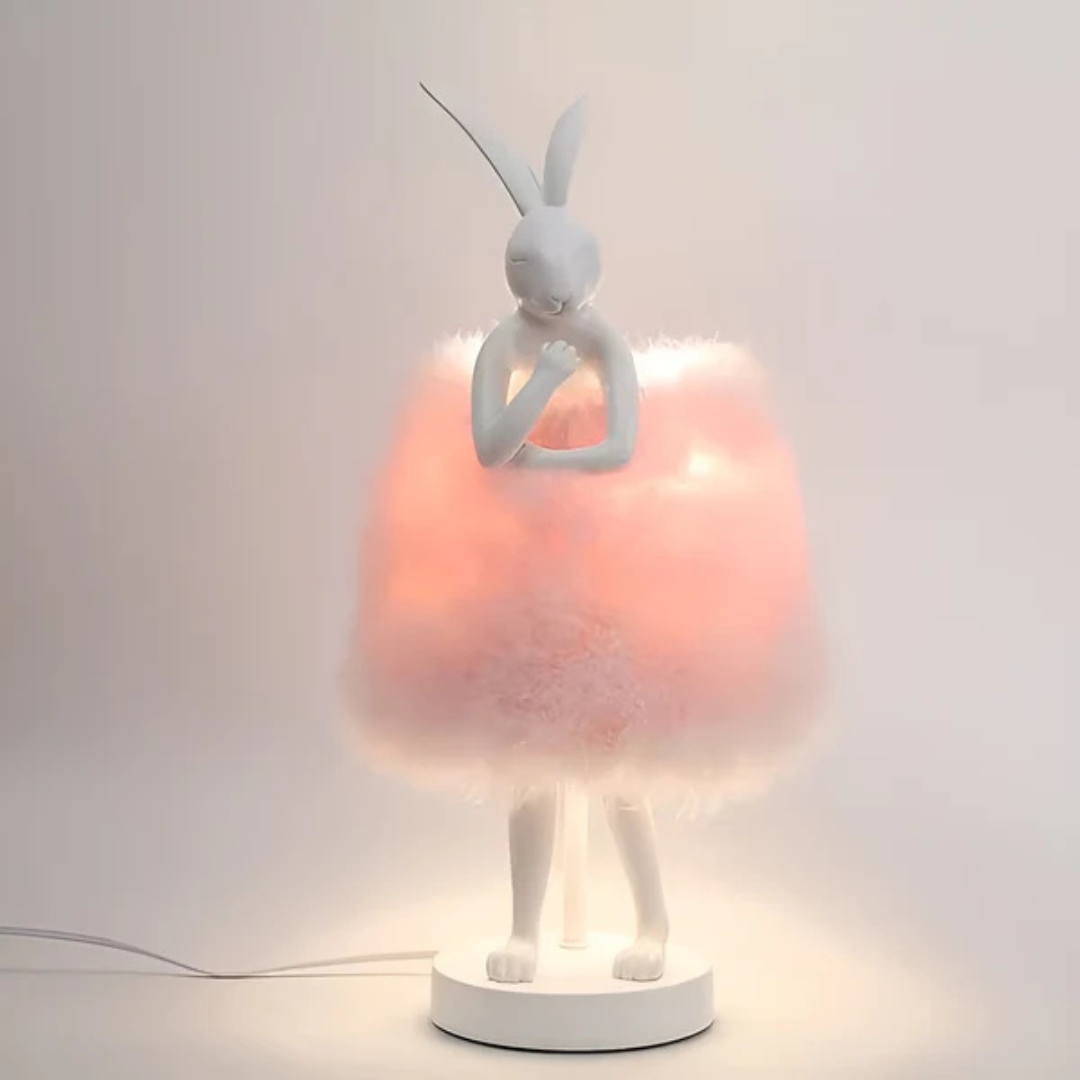 "Rabby - Lampada Notturna a Forma di Coniglio" can be rewritten as "Rabby - Lampada Notturna a Design di Coniglio".