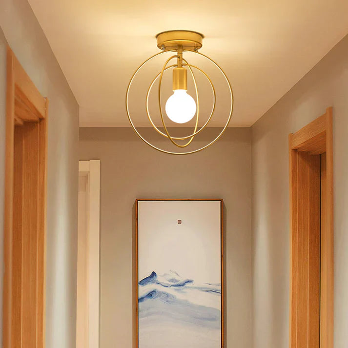 Thaleia - Lampada da soffitto moderna a forma di anello dorato" can be rewritten as:

"Thaleia - Lampada a soffitto moderna con design ad anello dorato