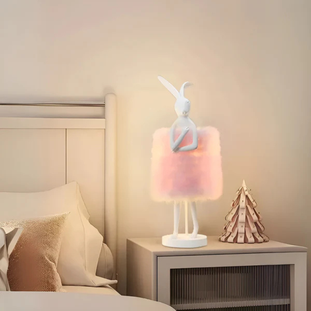 "Rabby - Lampada Notturna a Forma di Coniglio" can be rewritten as "Rabby - Lampada Notturna a Design di Coniglio".
