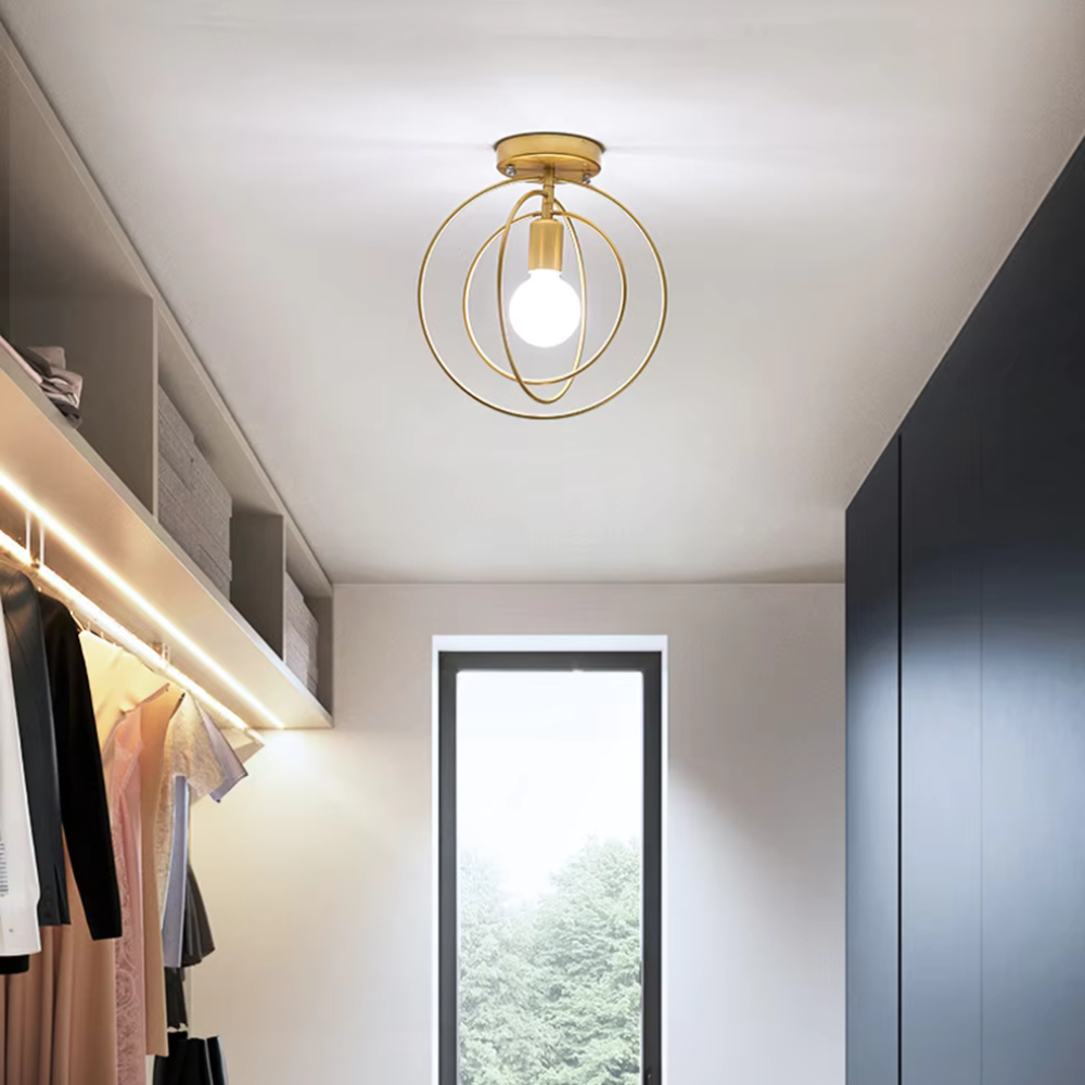 Thaleia - Lampada da soffitto moderna a forma di anello dorato" can be rewritten as:

"Thaleia - Lampada a soffitto moderna con design ad anello dorato